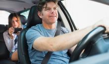 man driving with teen in backseat