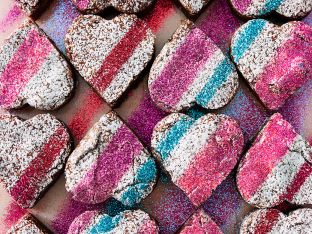 brownie hearts with colorful glitter and powdered sugar on top
