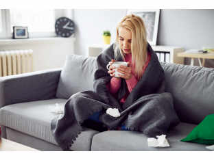 Sick woman drinking tea
