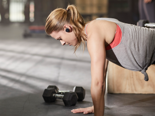 Woman working out wearing Bose SoundSport Free