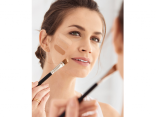 Woman testing foundation shades
