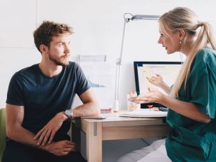 man talking to gynecologist