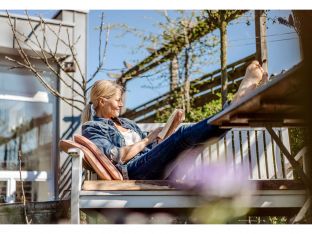 mom getting some self-care on the porch