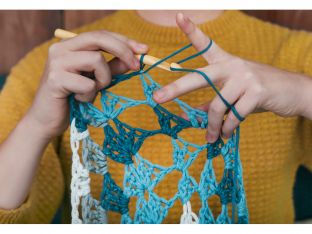 woman crocheting