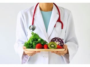 doctor with platter of fruits and veggies