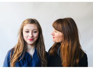 mom looking at teen daughter