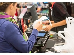 woman paying for groceries