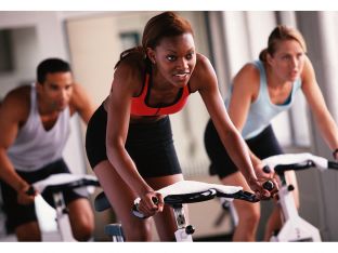 woman riding bike at gym