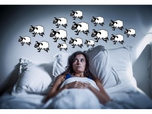 woman with insomnia counting sheep