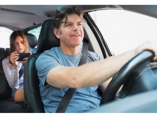 man driving with teen in backseat