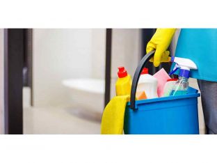 woman with a cleaning bucket in hand