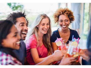group of adults having cocktails at a party
