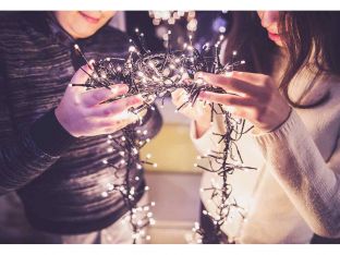 teens trimming the christmas tree