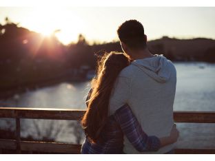 Young couple enjoying sunset