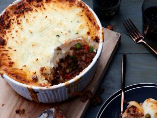 Instant Pot Shepherd’s Pie in baking dish on wooden board