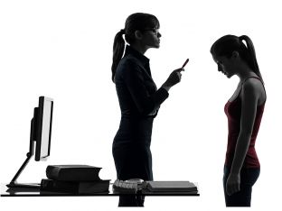 mother lecturing teen daughter in silhouette