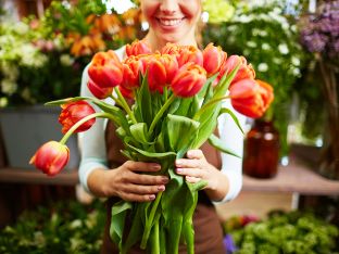 woman holding bouquet of tulips