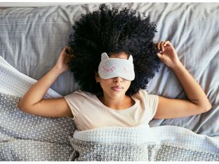 woman asleep wearing eye mask
