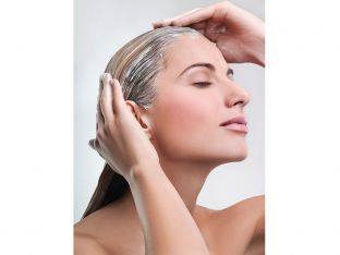 Woman applying hair mask