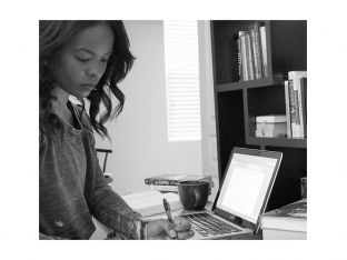 Author Dana L. Davis working at her computer