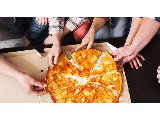 anonymous family eating pizza