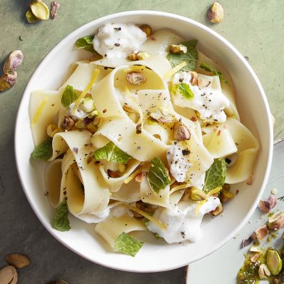 pappardelle with toasted pistachios and mint in white bowl