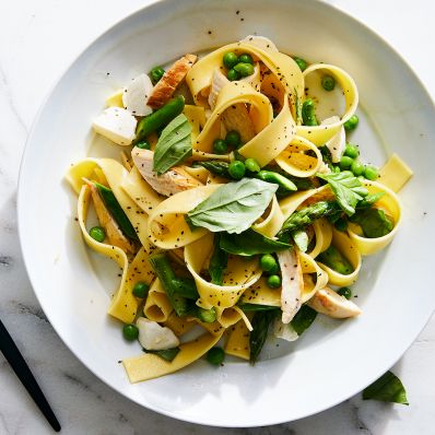 grilled chicken pasta white plate greens peas