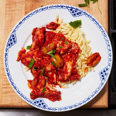 chicken puttanesca and orzo on plate
