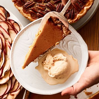 dishing pumpkin pie onto plate