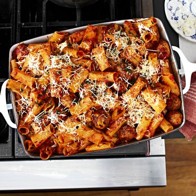 Baked Rigatoni and Meatballs in white pan on stove