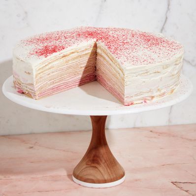 raspberry crepe cake on stand
