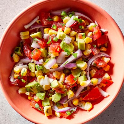 avocado-corn salsa in orange dish
