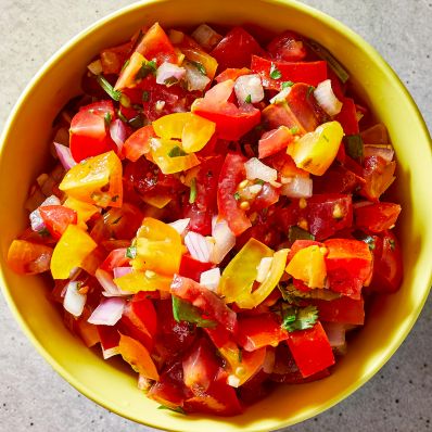 cherry tomato salsa in yellow bowl