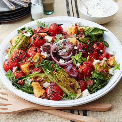 Grilled Little Gem Salad with Cherry Tomatoes, Smoked Bacon and Buttermilk-Blue Cheese Dressing