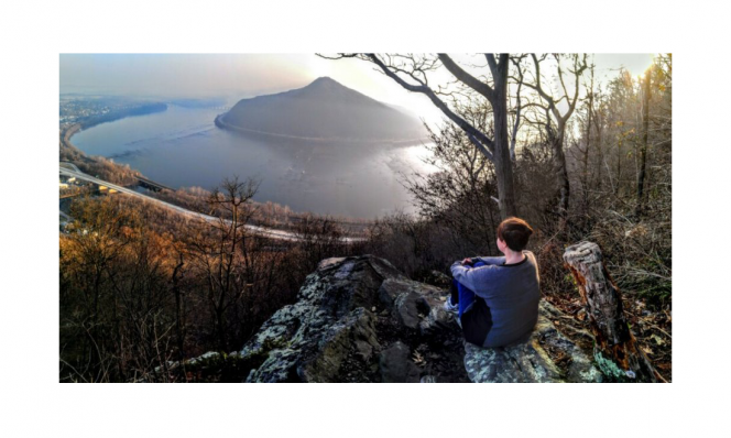Debby Michael sitting on mountain