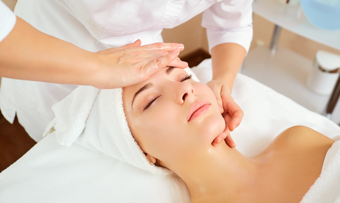 Woman getting facial peel