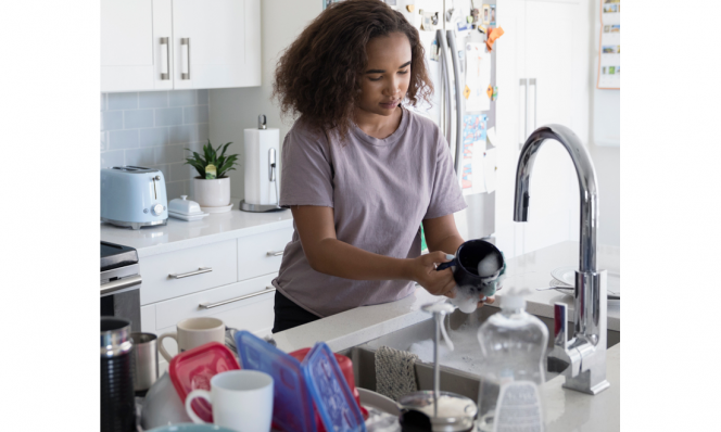 Daughter washing dishes