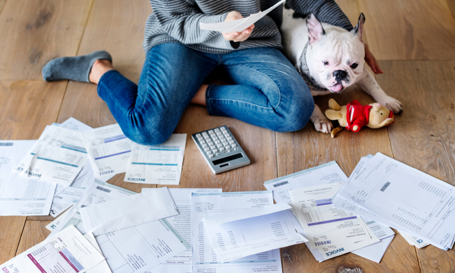 Woman on floor with tax papers