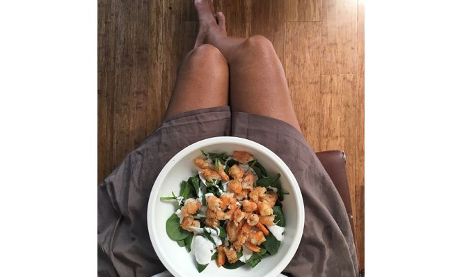 bowl of food on woman's lap