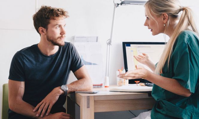 man talking to gynecologist