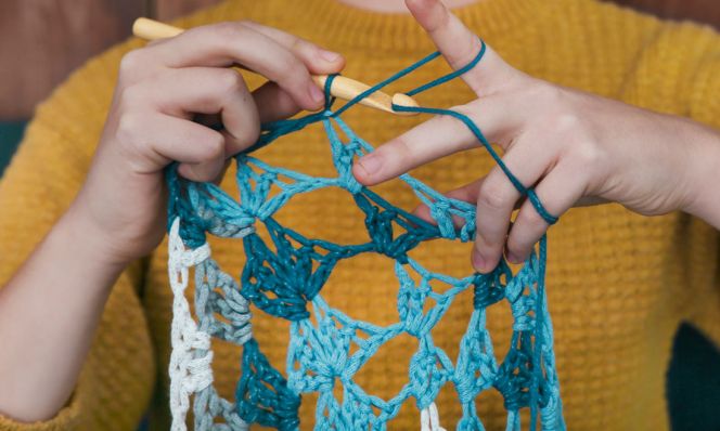 woman crocheting