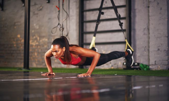 woman doing trx pushup