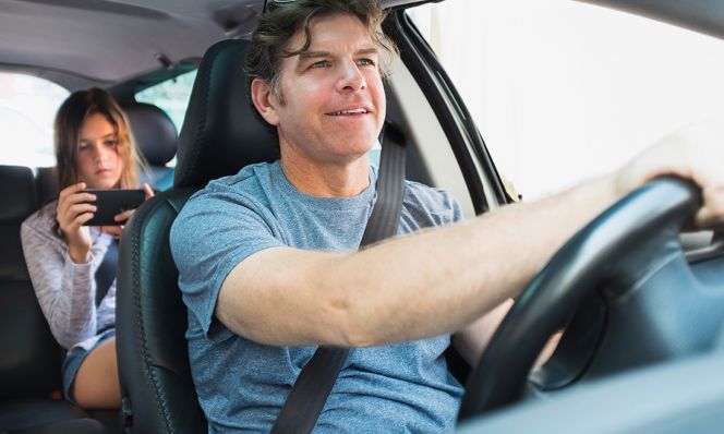 man driving with teen in backseat