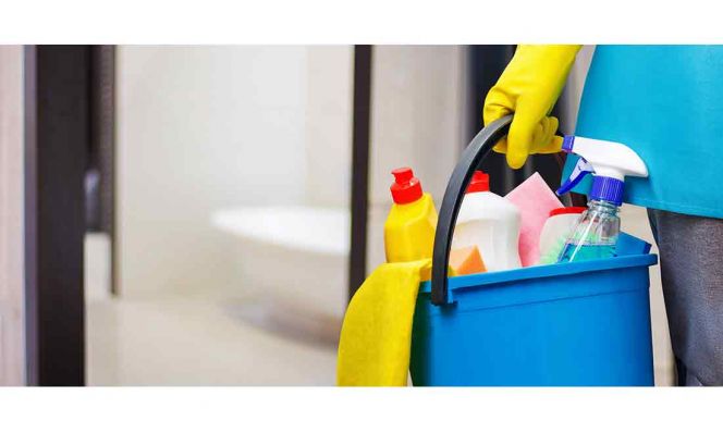 woman with a cleaning bucket in hand