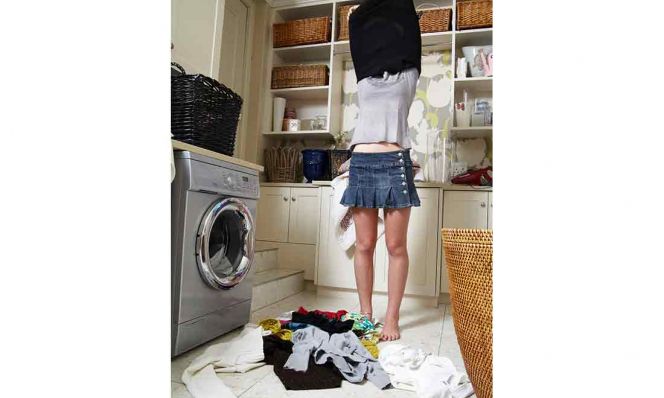teen girl changing clothes with laundry on floor