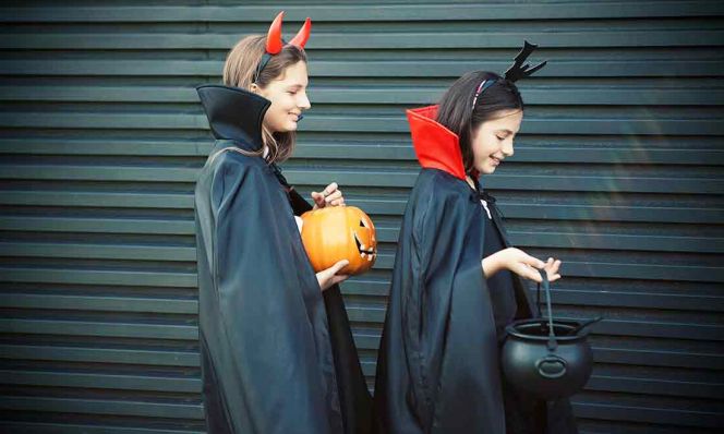 teens trick-or-treating for halloween