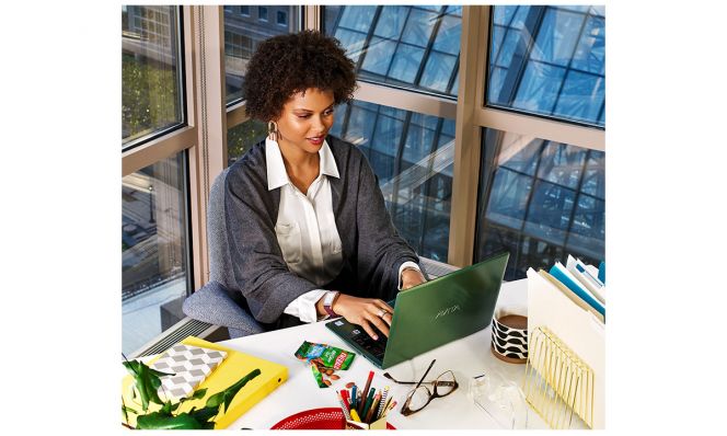 successful career woman working on laptop