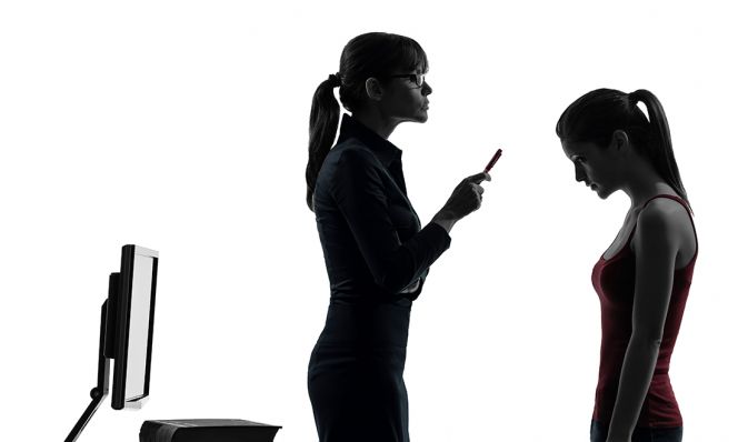 mother lecturing teen daughter in silhouette