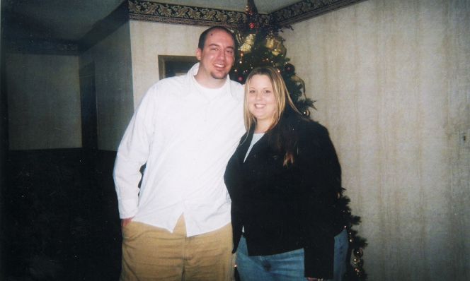 Tiffany Howard BEFORE her weight loss, posing in front of Christmas tree with husband