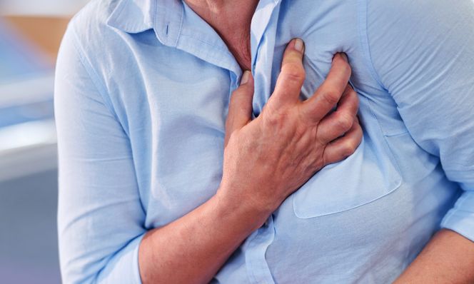 woman clutching chest